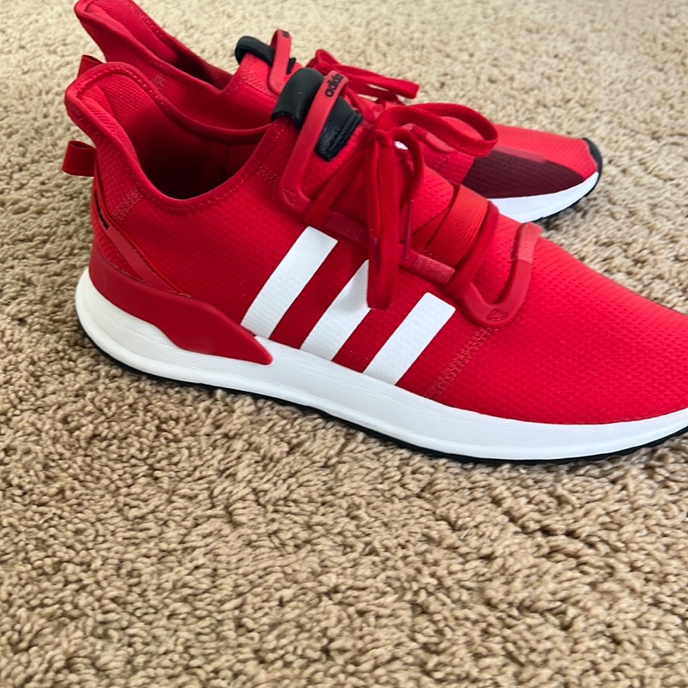 Adidas running shoes, size 13, red, good condition.